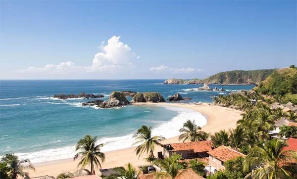 yoga vacation retreat on a clean water surf ocean tropical beach oaxaca mexico